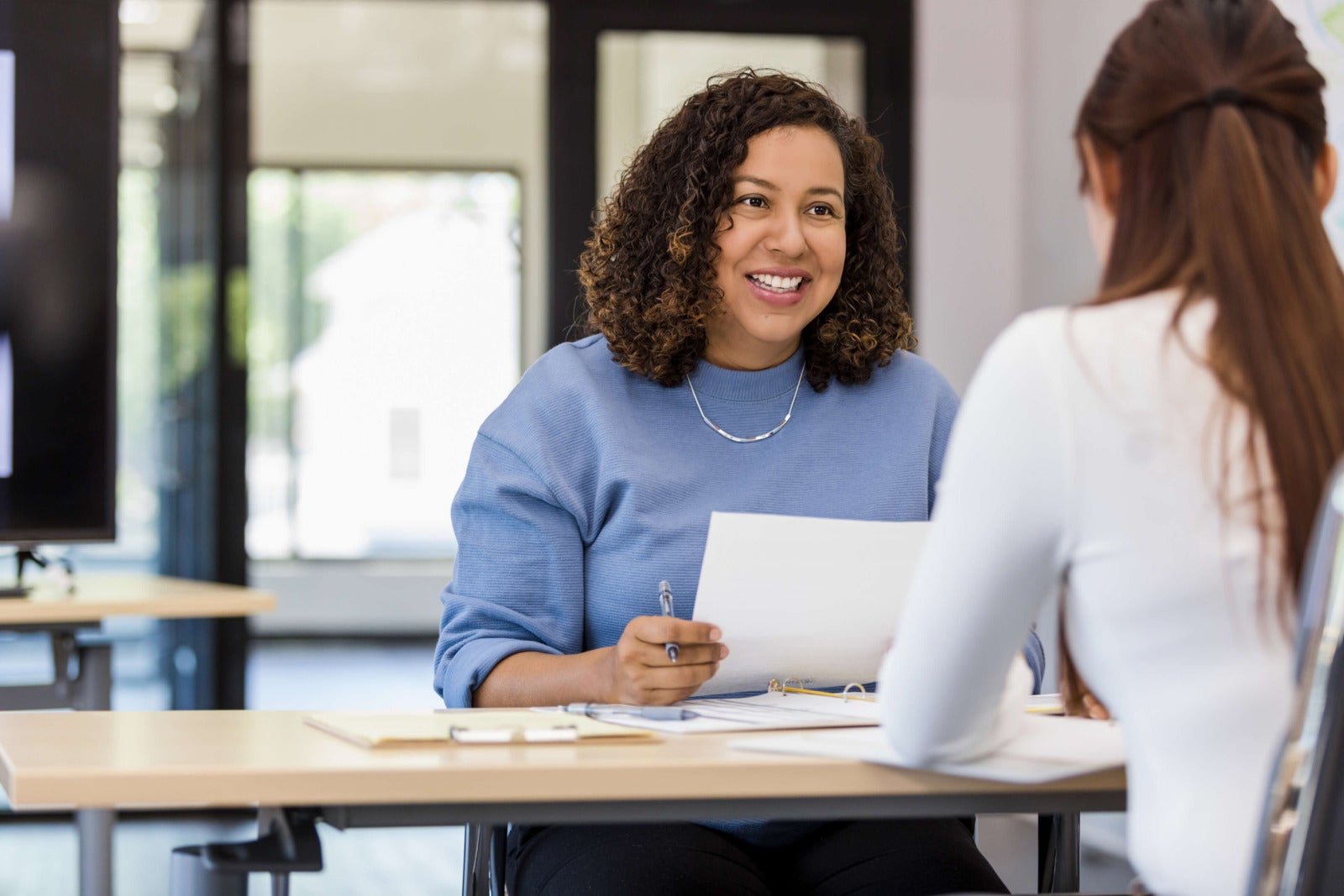 hiring manager speaks with job candidate
